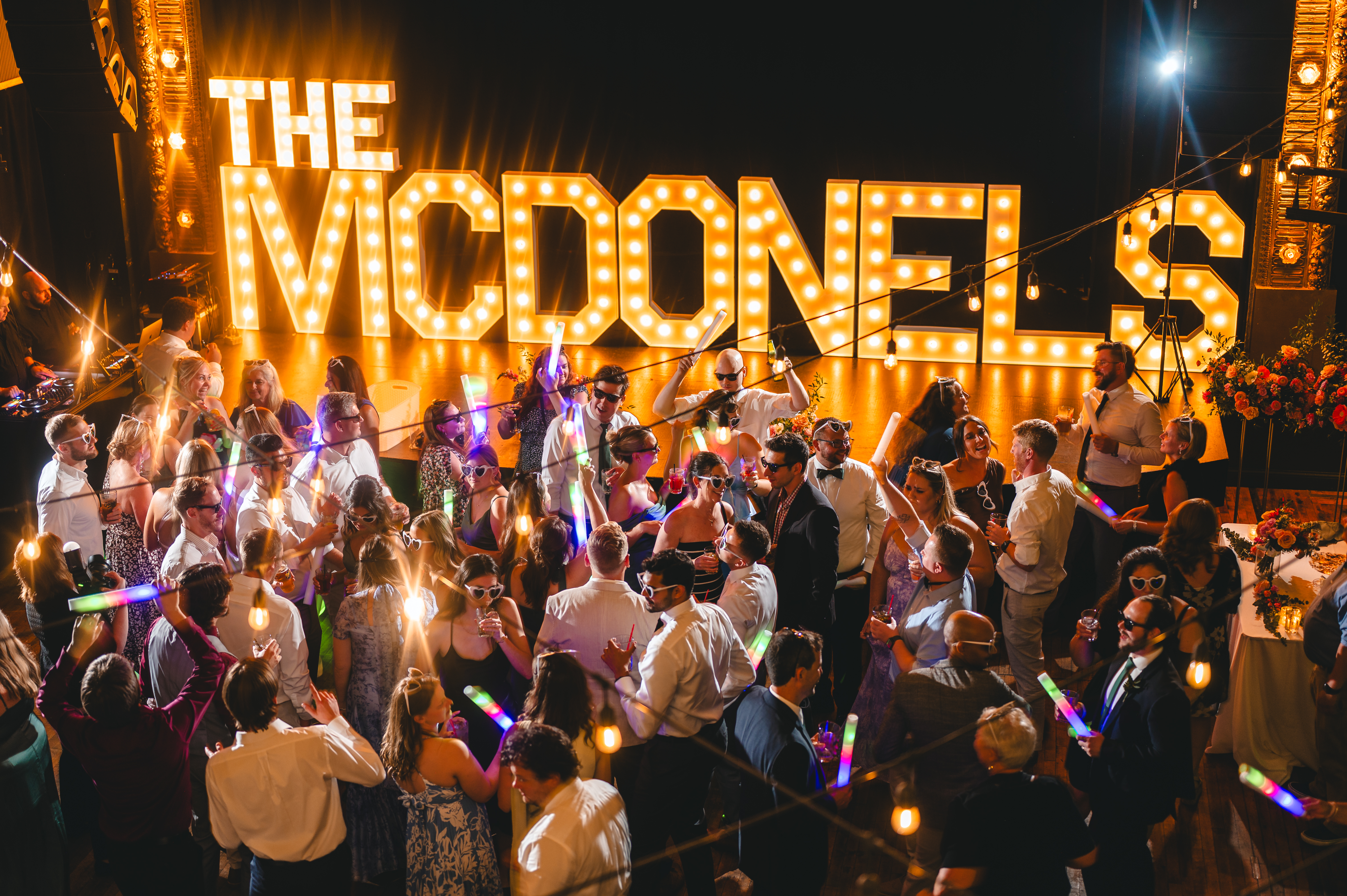 Our venue is the perfect blend of vintage charm and modern comfort. Built in 1913, The Woodward has all the architectural character and history that Cincinnati couples love — think exposed brick, towering ceilings, and our iconic marquee glowing in the heart of Over-the-Rhine. It’s a space that feels warm, inviting, and full of stories (just like your love).